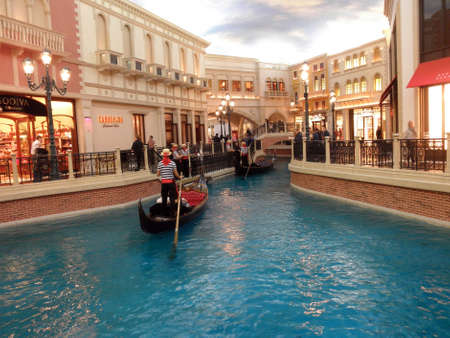 LAS VEGAS - FEBRUARY 7: Goldola, river, and Shops Inside the landmark Venetian Hotel in Las Vegas which is a replica of the Italian lifestyle February 7, 2010 in Las Vegas, Nevada.のeditorial素材