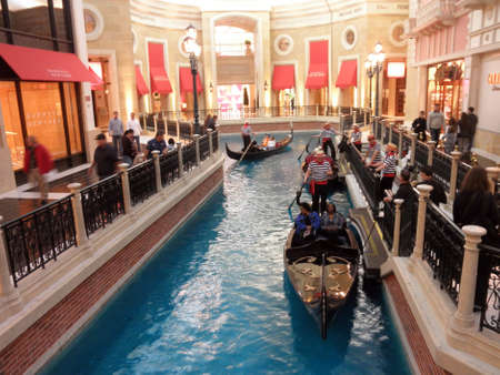 LAS VEGAS - FEBRUARY 7: Gondola, river, and Shops Inside the landmark Venetian Hotel in Las Vegas which is a replica of the Italian lifestyle February 7, 2010 in Las Vegas, Nevada.のeditorial素材