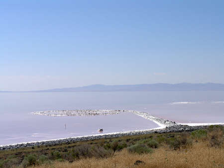 SALT LAKE, UTAH - AUGUST 25: view of Spiral Jetty swirls in the water, Robert Smithson's masterpiece earthwork, on the north side of the Great Salt Lake, about two-and-a-half hours from Salt Lake City. AUGUST 25, 2005のeditorial素材