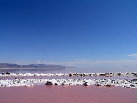SALT LAKE, UTAH - AUGUST 25: Spiral Jetty circular swirls in pink water, viewed from center of...