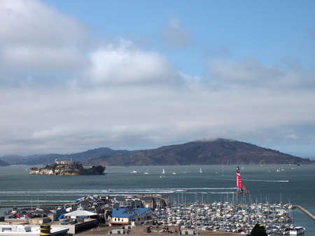 SAN FRANCISCO-SEPT 14:  New Zealand Team passes Alcatraz Island and Fisherman's Wharf during the race of America's Cup with New Zealand on Sept. 14, 2013 in San Francisco. USA won the race in a historic comeback.のeditorial素材