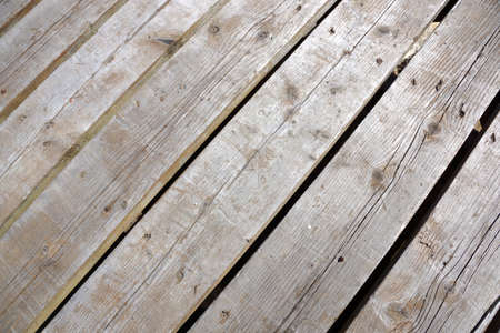 wood plank walkway with small cracks at a slanted angle.の写真素材