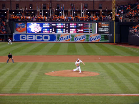 Baltimore, MD - JUNE 11: Orioles pitcher Wei-Yin Chen throws ball from mound which can be seen in...