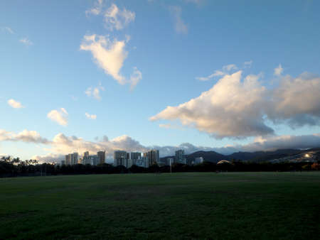Kapiolani Park at Dusk with Hotels of Waikiki in the distance on Oahu, Hawaii.の写真素材