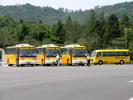 SEOUL, SOUTH KOREA - MAY 31: South Korean School Buses in parking lot. The School Bus transport the...