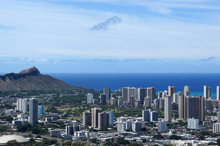Corner of Diamondhead and the city of Honolulu on Oahu on a nice day. UH Manoa, Waikiki, Kahala and the H-1 Visible, seen from Round Top Dr. lookout point.の写真素材