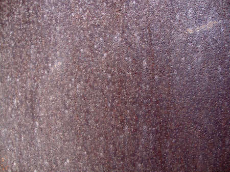 Background of old rusty metal with dots. Grunge texture. の写真素材