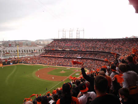 SAN FRANCISCO, CA - OCTOBER 28: Giants fans throughout the ballpark cheer as they waving rags as Giants pitcher throws ball game 2 of the 2010 World Series game between Giants and Rangers Oct. 28, 2010 AT&T Park San Francisco, CA. のeditorial素材