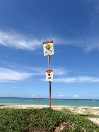 Dangerous shore break and Steep cliff Warning Signs at Baldwin Beach Maui.の写真素材