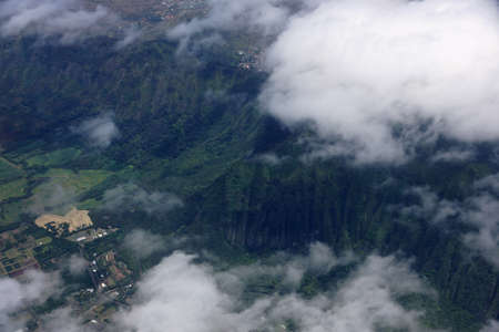 Aerial view of clouds over Waimanalo Farm lands, koolau mountains, and ridge communities of Honolulu on the island of Oahu in the state of Hawaii.の写真素材