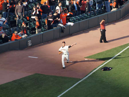 SAN FRANCISCO, CA - OCTOBER 20: San Francisco Giants vs. Philadelphia Phillies: Giants Madison Bumgarner step forward to throws pitch in bullpen to warm up before the start of game four of the NLCS 2010 taken October 20, 2010 AT&T Park San Francisco Califのeditorial素材
