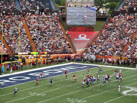 HONOLULU - JANUARY 29: NFC Quarterback Drew Brees throws ball towards end zone with other All-star Players in motion during play and ball seen flying in the air during ProBowl Game taken January 29, 2012 in Honolulu, Hawaii.のeditorial素材
