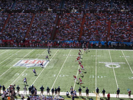 HONOLULU - JANUARY 29: AFC team kicks off ball to NFC football team, these All-star Players are in motion during play with crowd and sideline in view during ProBowl Game taken January 29, 2012 in Honolulu, Hawaii.のeditorial素材