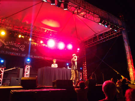 HONOLULU - FEBRUARY 28:  MC Yogi Sings into Mic with DJ Drez spinning tracks on stage at Wanderlust Festival on the North Shore of Oahu, Hawaii December 22, 2014.のeditorial素材