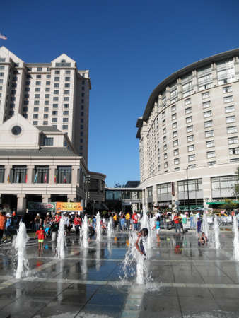 SAN JOSE, CA - AUGUST 5:  Kids play in the interactive water jets fountain at Plaza de Cesar Chavez Park in San Jose, California on August 5, 2010.のeditorial素材