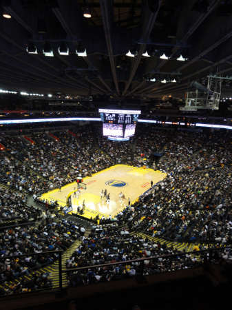 OAKLAND CA - MARCH 11: Magic vs. Warriors: Golden State Warriors Player passes ball while Orlando Magic players try to steal ball at Oracle Arena taken March 11 2011 Oakland California.のeditorial素材