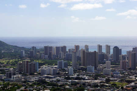Aerial of  Honolulu, Diamond Head, Waikiki, Buildings, parks, hotels and Condos with Pacific Ocean stretching into the distance on nice day.の写真素材