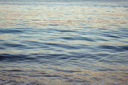 Ocean Water ripples off the coast of Oahu reflecting light.  Good for backgrounds textures.の写真素材