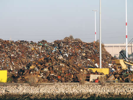 Pile of trash at Recycling processing facility along shore of Oakland Harbor, California during the...