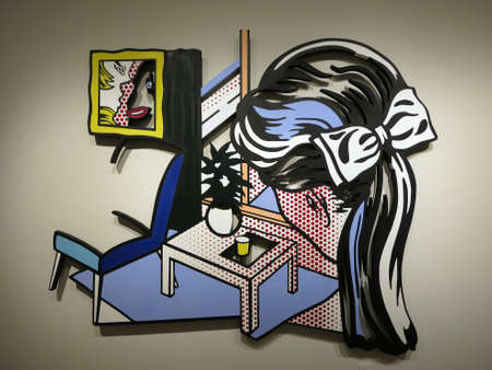 HONOLULU, HI - MAY 9, 2015: Woman Contemplating a Yellow Cup, 1995 - Roy Lichtenstein.  Wall-relief sculptues made two years before his death on display at the Honolulu Musuem of Art in the city of Honolulu, Hawaii December 6, 2014.のeditorial素材