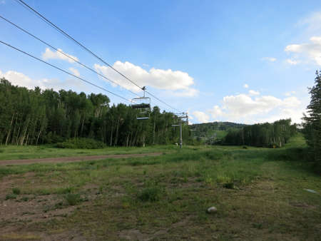 Gondola line goes up mountain as it sits empty in the summer at Snowmass, Colorado.の写真素材
