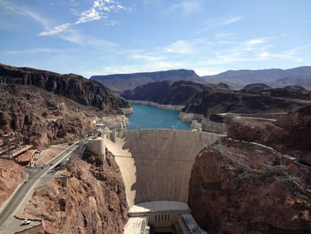 Aerial view of the Colorado River and Hoover Dam and road leading to dam, a snapshot taken from bypass bridge on the border of Arizona and Nevada, USA. July 2011.の写真素材