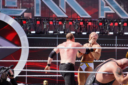 SANTA CLARA - MARCH 29: WWE Wrestler Kane puts hand around neck of Cesaro to setup for a chokeslam during andre the giant battle royal 2015 at Wrestlemania 31 at the Levi's Stadium in Santa Clara, California on March 29, 2015.のeditorial素材