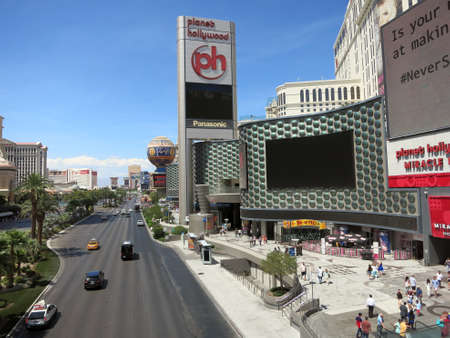LAS VEGAS - JUNE 29: Planet Hollywood Hotel Miracle Mile and Paris hotel with cloudy sky Las Vegas Boulevard on June 29, 2015 in Las Vegas.のeditorial素材