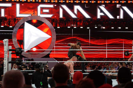 SANTA CLARA - MARCH 29: Seth Rollins curb stomps WWE Champion Brock Lesner face into the ground at Wrestlemania 31 at the Levi's Stadium in Santa Clara, California on March 29, 2015.のeditorial素材