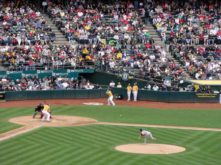 OAKLAND, CA - APRIL 20: Red Sox vs. A's:  A's batter Landon Powell waits on incoming pitch from Red Sox Pitcher Clay Buchholz which can be seen flying in the air. April 20 2011 Oakland coliseum California.のeditorial素材