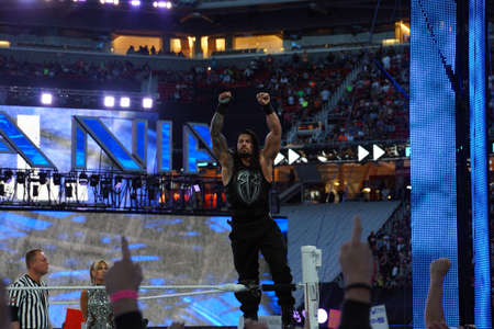 SANTA CLARA - MARCH 29: Roman Reigns wrestler stands on top turnbuckle with arms in the air before start of championship match at Wrestlemania 31 at the Levi's Stadium in Santa Clara, California on March 29, 2015.のeditorial素材