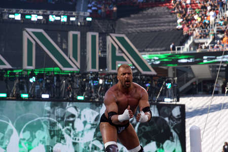 SANTA CLARA - MARCH 29: Triple H points at himself as he stands on top of turnbuckles looking out into crowd before match at Wrestlemania 31 at the Levi's Stadium in Santa Clara, California on March 29, 2015.のeditorial素材