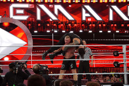 SANTA CLARA - MARCH 29: WWE Champion Brock Lesner sets up to F-5 Roman Reigns by placing him on top of his shoulders at Wrestlemania 31 at the Levi's Stadium in Santa Clara, California on March 29, 2015.のeditorial素材