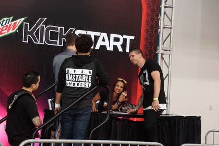 SAN JOSE - MARCH 28: NXT Diva Sasha Banks shows off 'Boss' Ring as she poses with fan for photograph at WWE Axxess event at the McEnery Convention Center in San Jose, California on March 28, 2015.のeditorial素材