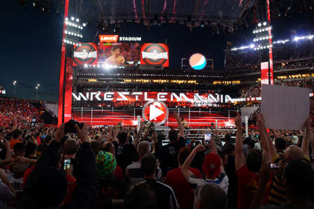 SANTA CLARA - MARCH 29:  Seth Rollins celebrates with fans victory of the WWE Championship belt after winning main event match at Wrestlemania 31 at the Levi's Stadium in Santa Clara, California on March 29, 2015.のeditorial素材