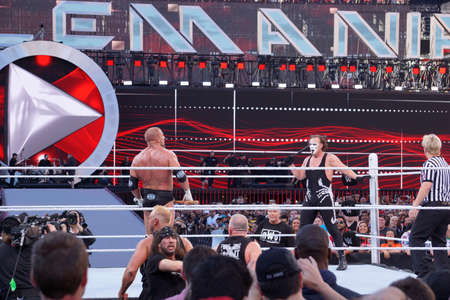 SANTA CLARA - MARCH 29: Triple H holds sledgehammer and Sting holds bat in ring during match with NWO and DX on the outside at Wrestlemania 31 at the Levi's Stadium in Santa Clara, California on March 29, 2015.のeditorial素材