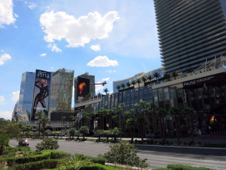 LAS VEGAS - JUNE 29: Cosmopolitan and Aria hotels and signs on Las Vegas Boulevard on June 29, 2015 in Las Vegas.のeditorial素材