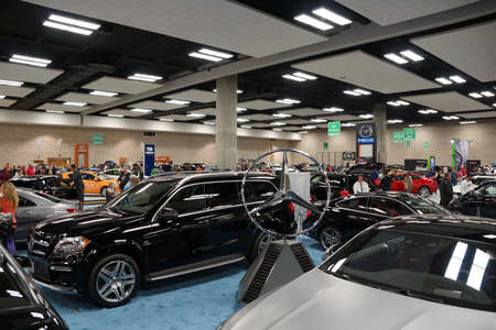 HONOLULU - MARCH 14, 2015: People look at Vehicles on display on display at the Motor Show exhibition - 2015 First Hawaiian International Auto Show at the Convention Center in Oahu, Hawaii.  March 14, 2015.のeditorial素材