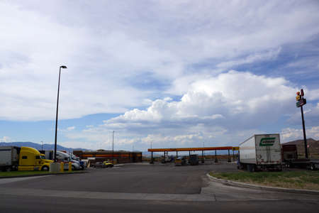 UTAH - JUNE 30: Trucks parked at Loves Gas Station travel center. Love's Travel Stops & Country Stores is a family-owned chain of more than 350 travel stops and convenience stores located in 40 states.  June 30, 2015 Utah.のeditorial素材