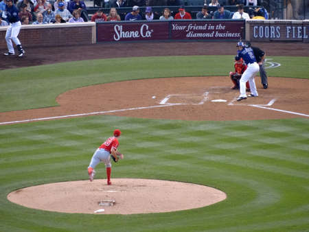DENVER - JULY 7: Angels pitcher Andrew Heaney throws pitch to Rockies batter Troy Tulowitzki as he waits on incoming pitch on July 7, 2015 in Denver, Colorado.のeditorial素材