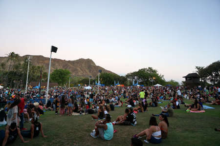 WAIKIKI, OAHU - JULY 25:  Crowd of people hangs out on the lawn at MayJah RayJah Concert at the Waikiki Shell with Diamond Head in the background taken July 25, 2014 Waikiki, Hawaii.のeditorial素材