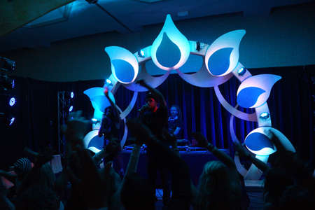 SNOWMASS, CO - JULY 4:  MC Yogi snaps with crowd with DJ Drez behind him in blue light at indoor concert during Wanderlust festival at Snowmass  in Colorado on July 4, 2015.のeditorial素材