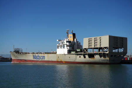 OAKLAND - OCTOBER 12:  Matson shipping boat is unloaded by cranes in Oakland Harbor. The fourth busiest container port in the country, it's a major economic engine in the San Francisco Bay Area.  Oakland California on October 12, 2015.のeditorial素材