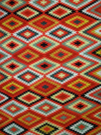 Pattern Red, Orange, White, Green, Black, and blue Diamond Blanket/ Rug - Navajo Artist, made about 1885 of cotton and wool.の写真素材
