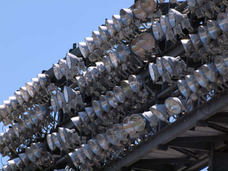 Rows of High Power Stadium Lights attached to top deck of Stadium Ballpark.の写真素材