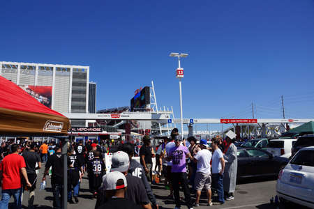 SANTA CLARA - MARCH 29: Wrestling fans Cosplay have fun tailgating parking lot before the start of...