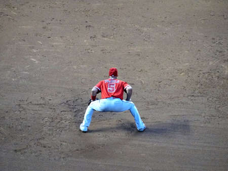 DENVER - JULY 7: Angels first baseman Albert Pujols squats as he waits for play among the dirt on July 7, 2015 in Denver, Colorado.のeditorial素材