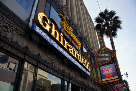 LOS ANGELES, USA - JANUARY 23: Disney Studio Store and Ghirardelli Sign on Hollywood Boulevard with ad for Mary Poppins Sing-A-Long on  January 23, 2014 in Los Angeles, California.のeditorial素材