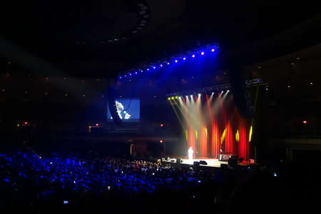 HONOLULU, HI - SEPTEMBER 27, 2014: Comedian Katt Williams on stage in front of large crown on stage...
