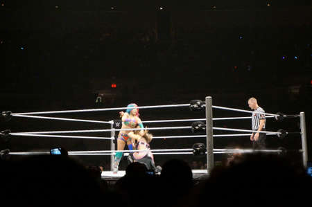 HONOLULU - JUNE 29, 2016: WWE wrestlers Natalya Neidhart vs Asuka in ring at WWE event at the Neal S. Blaisdell Center, Honolulu on June 29, 2016 Honolulu, Hawaii.のeditorial素材